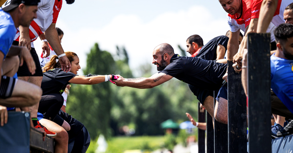 Two Young runners from Amusnet shaking hands during the Legion Run 2023 event